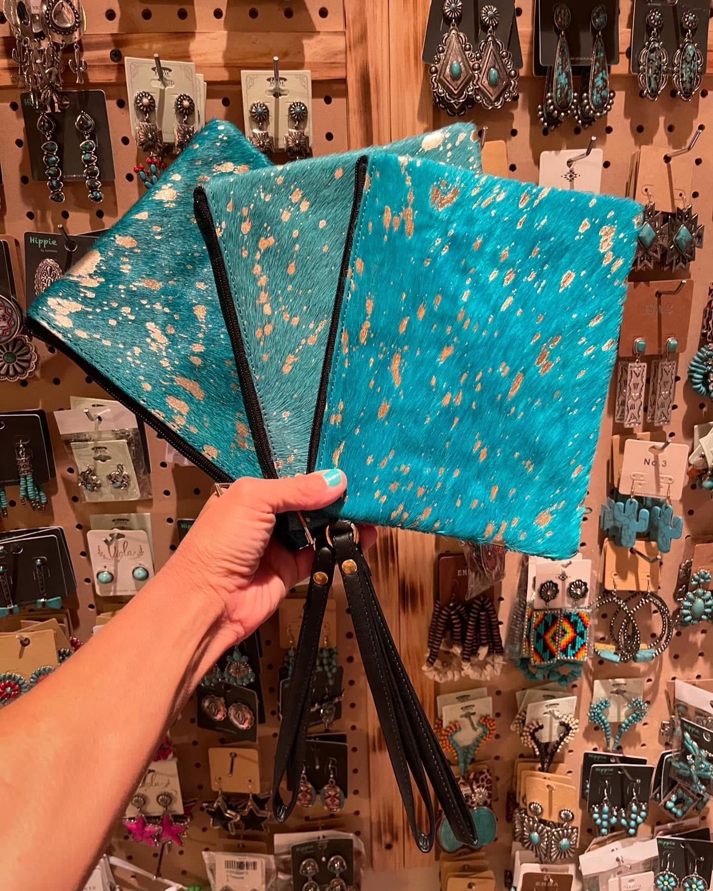 Turquoise cowhide cosmetic bag